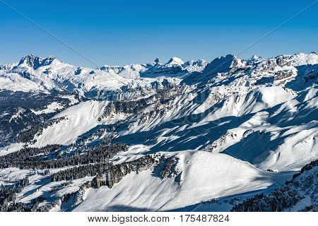 Beautiful Mountains In Snow. Evening Aerial View With Shadows.