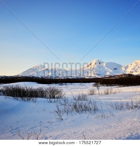 Aerial image of snow-covered Russian Volcano. Kamchatka.