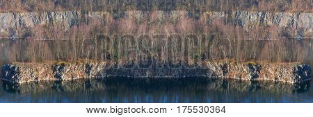 Panoramic view of an old open opencast mine of limestone works in Wuelfrath Germany on a winter day.