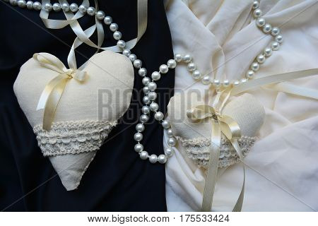 two vintage heart on a black and white background with pearls, wedding decor