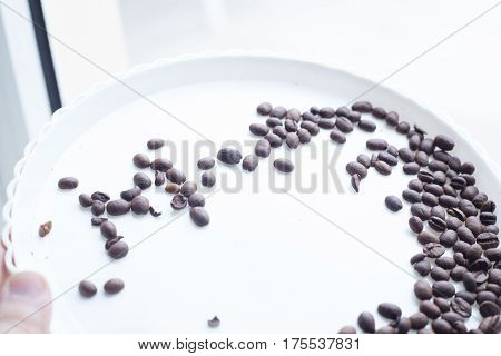 Coffee Beans On A White Plastic Plate. Beautifull Background. Love. Insparation. On White Plate.