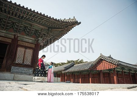 Beautiful Korean girl in Hanbok at Gyeongbokgung the traditional Korean dress.