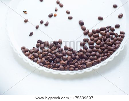 Coffee Beans On A White Plastic Plate. Beautifull Background. Love. Insparation. On White Plate.