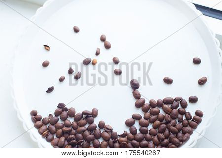Coffee Beans On A White Plastic Plate. Beautifull Background. Love. Insparation. On White Plate.