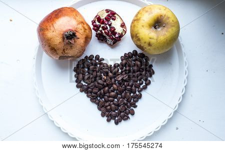 Coffee Beans In Form Of Heart On Beautifull Background. Love. Insparation. On White Plate.