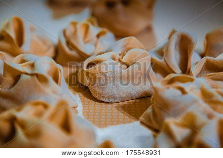 Preparation Of Manti On A Kitchen Wooden Board. Traditional Asian Dumplings