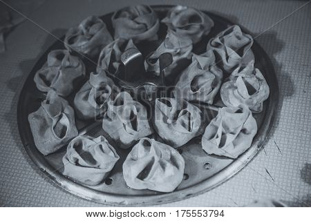 Preparation Of Manti On A Kitchen Wooden Board. Traditional Asian Dumplings