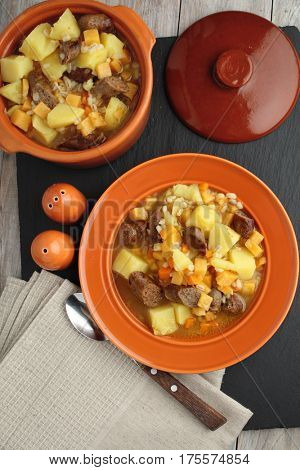 Traditional Irish dish Dublin coddle with sausages on a table