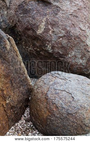 Big stones in the ornamental garden close up.