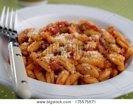 Capunti with Parmesan cheese and tomato sauce
