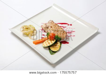 Pork Medium Rare With A Side Dish Of Grilled Zucchini Flavored Cranberry Sauce