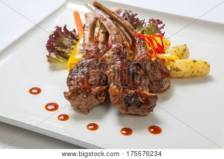 Pork Ribs Grilled With Roasted Vegetables And Boiled Potatoes