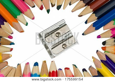 Colored pencils with an iron sharpener in the middle