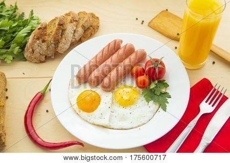 Fried Eggs And Fried Sausage For Breakfast.