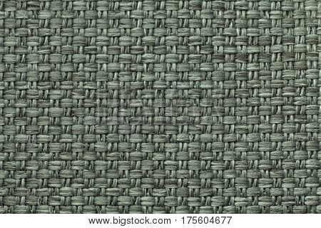 Pale green background with checkered pattern closeup. Structure of the fabric macro.