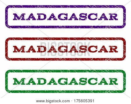 Madagascar watermark stamp. Text caption inside rounded rectangle frame with grunge design style. Vector variants are indigo blue, red, green ink colors. Rubber seal stamp with dirty texture.