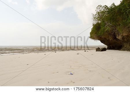 Small cove with a rock on the white sand of the bamburi beach in Mombasa Kenya