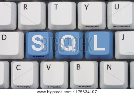 Computer coding with SQL A close-up of a keyboard with blue highlighted text SQL 3D Illustration