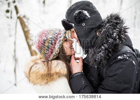 Happy Young Couple Having Fun In The Winter Park