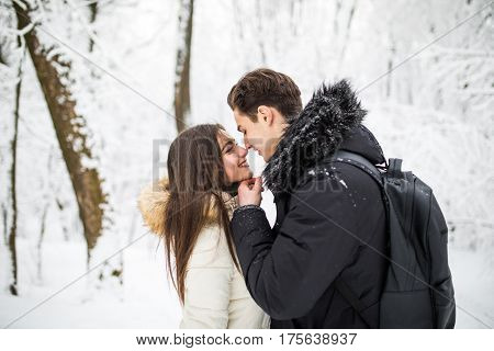 Happy Young Couple Having Fun In The Winter Park