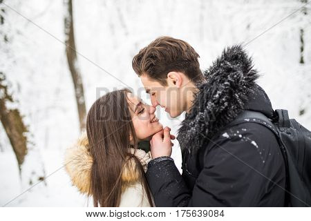 Happy Young Couple Having Fun In The Winter Park