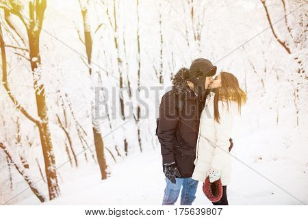 Happy Young Couple Having Fun In The Winter Park