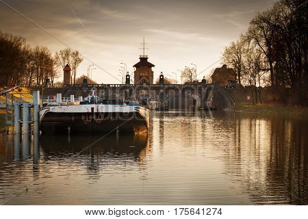 Old lock chamber with ship during sunset near city Melnik.