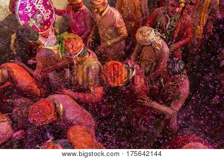 Nandgaon, India - March 18, 2016: Barsana villagers come to Nandgaon village to celebrate Lathmar Holi in Nandgaon, Uttar Pradesh, India.