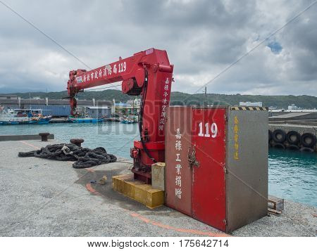 Shimen Taiwan - October 03 2016: Red crane in the fishing port in Shimen.