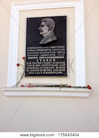 SIMFEROPOL CRIMEA UKRAINE - FEB 28 2017: Memorial plaque in honor of Stalin on main office of Communist Party of Russian Federation CPRF in Simferopol Crimea Ukraine on Feb 28 2017.