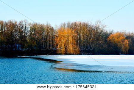 The lake was frozen because cold weather