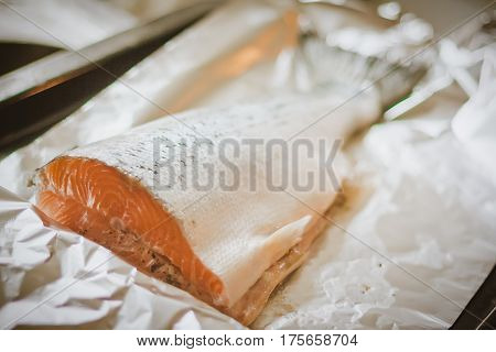 Fish salmon prepared for cooking on foil