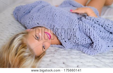 blonde in Lace Pullover Sweater looking at the camera