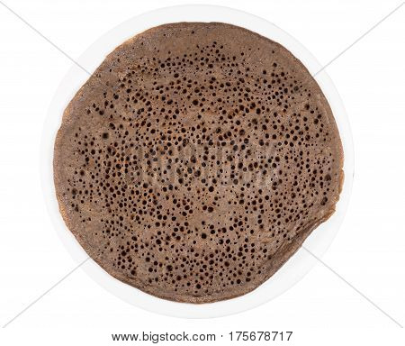 Traditional Ethiopean flatbread from fermented teff flour on a white plate