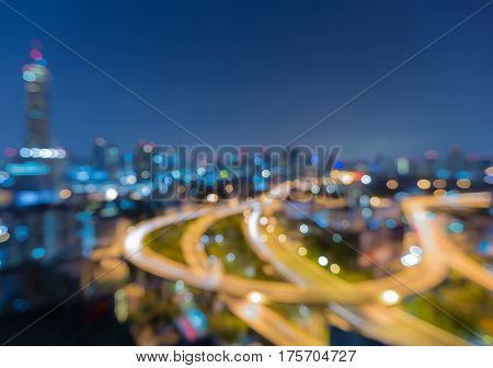 Aerial view blur bokeh light Bangkok city central business downtown with twilight sky background