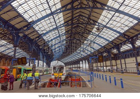BRIGHTON GREAT BRITAIN - MAR 01 2017: Trains and workers in the beautiful old train station in Brighton UK. March 01 2017 in Brighton Great Britain
