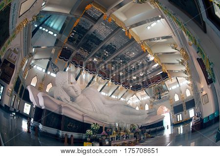 UDON THANI,THAILAND-JANUARY 25,2014 : The 20-meter long reclining Buddha, which is made from 43 blocks of exquisite Italian Carrara Marble, in Wat Pa Phu Kon of, Ban Na Kham, Ban Kong sub-district , Na yung District in Udon Thani Province, Thailand.