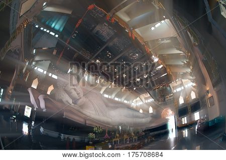 UDON THANI,THAILAND-JANUARY 25,2014 : The 20-meter long reclining Buddha, which is made from 43 blocks of exquisite Italian Carrara Marble, in Wat Pa Phu Kon of, Ban Na Kham, Ban Kong sub-district , Na yung District in Udon Thani Province, Thailand.