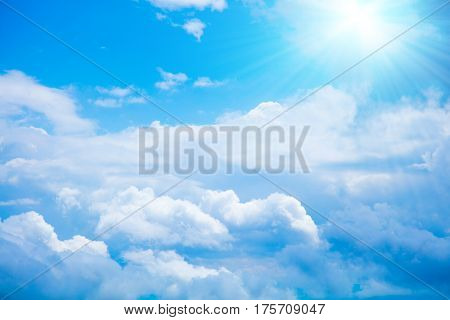 Blue sunny summer sky with some clouds.