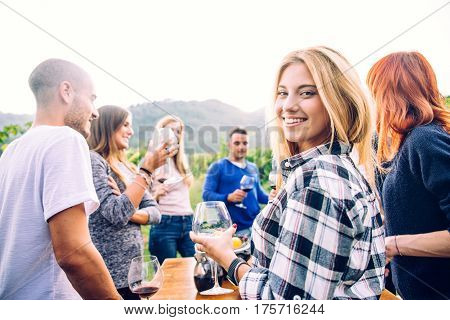 Group of friends at restaurant outdoors - People having dinner in a home garden