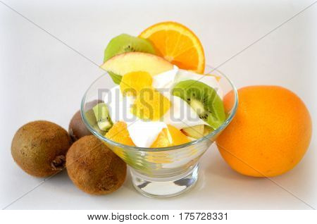 Dessert - fruit with cream, kiwi, apple and orange