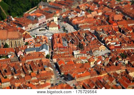 Aerial view of Brasov city in Transylvania Romania. Tilt shift lens effect