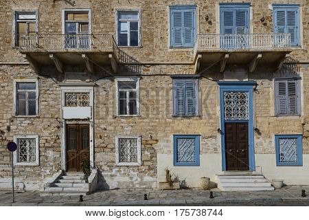 Facades of old buildings in Ermoupoli town on Syros island in Greece.