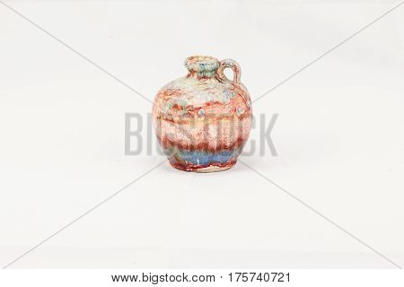 ceramic pink, grey, blue and yellow jug