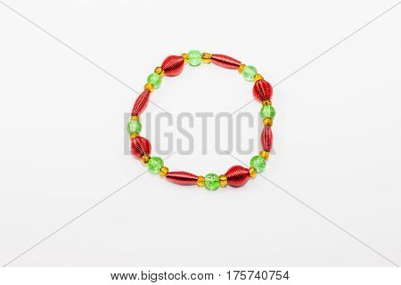 had crafted red gold and green beaded bracelet