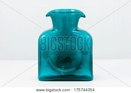 a blue glass water jug, hand crafted