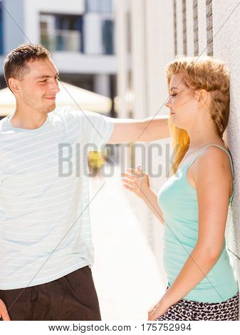 Man Flirting With Girl On City Street