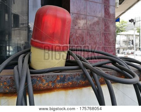Red siren Police check point Flashing emergency light leave on the street with blur background Red lights emergency Raster version with wall background