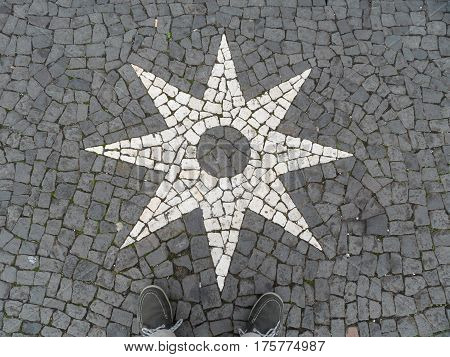 Typical Portuguese black and white stone mosaic 