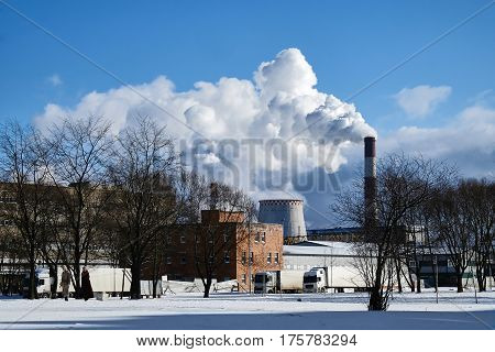 the thick smoke belching from factory chimneys